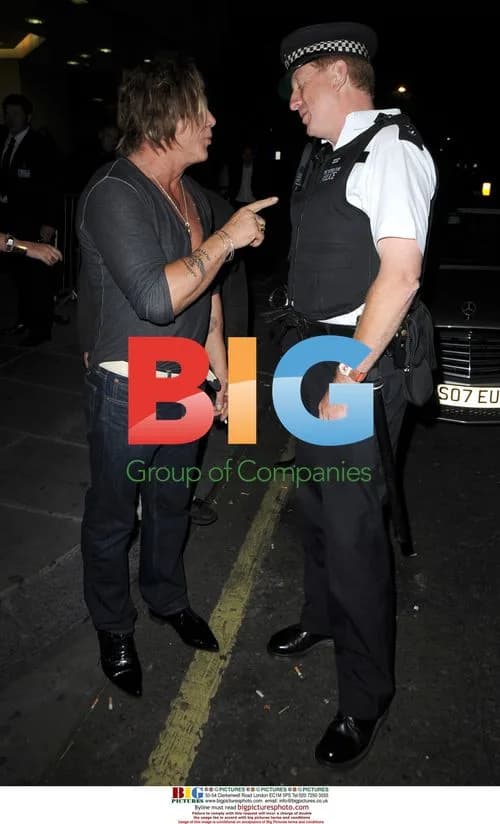 Mickey Rourke Poses with London Policeman