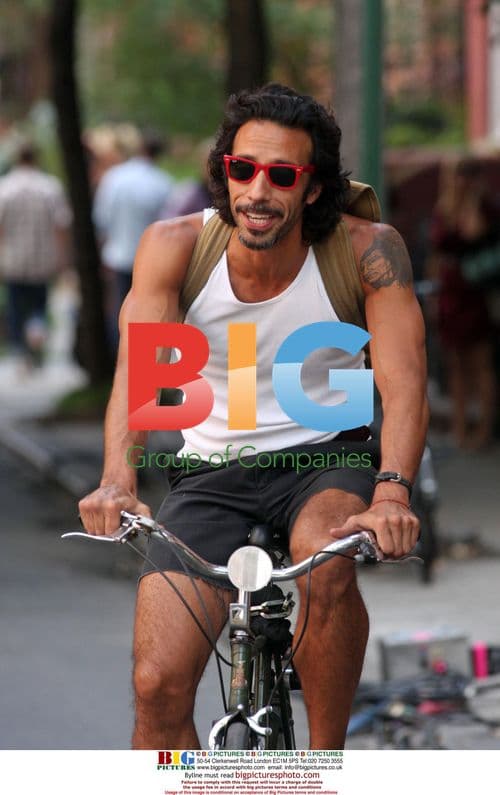 Carlos Leon Rides Bike in West Village