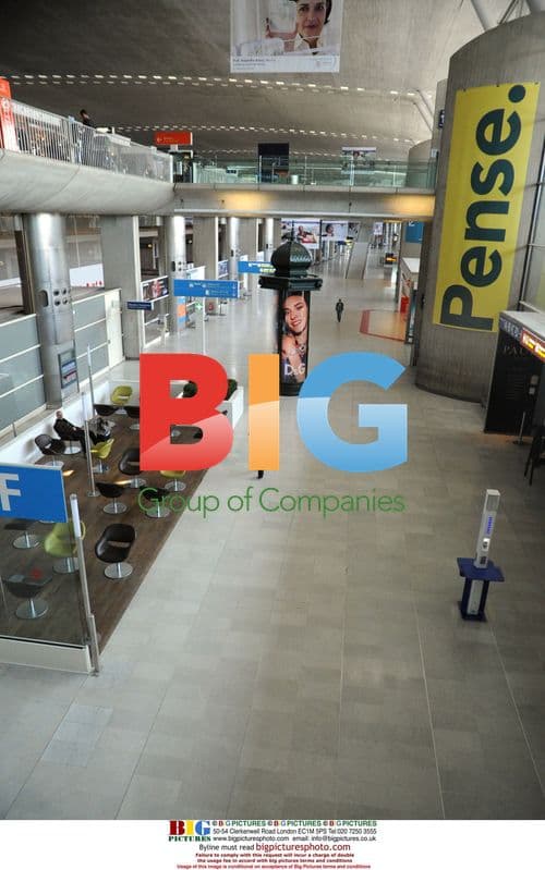 Passenger Rests at Airport Amid Ash Disruption