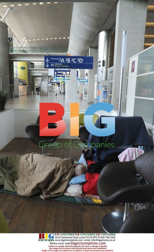 Passenger Rests at Paris Airport During Volcanic Ash Disruptions