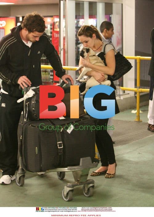 Kelly Brook Arrives at Heathrow with Boyfriend