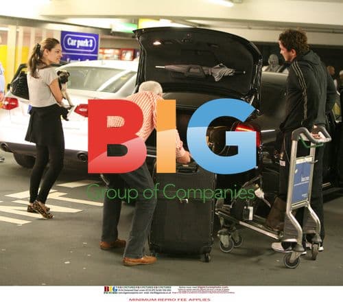 Kelly Brook Arrives at Heathrow with Danny Cipriani