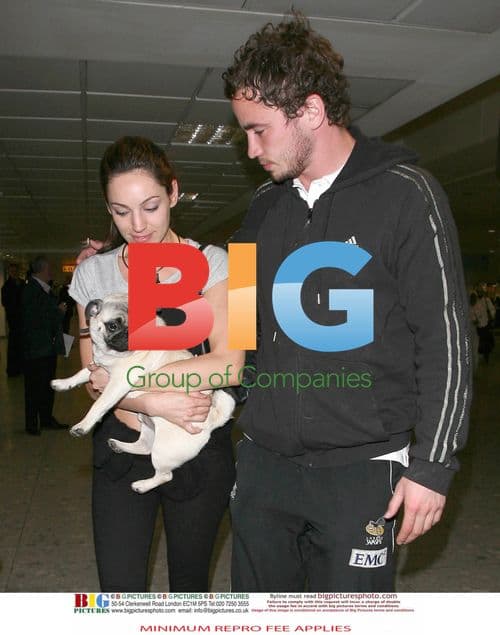 Kelly Brook Arrives at Heathrow with Boyfriend Danny Cipriani