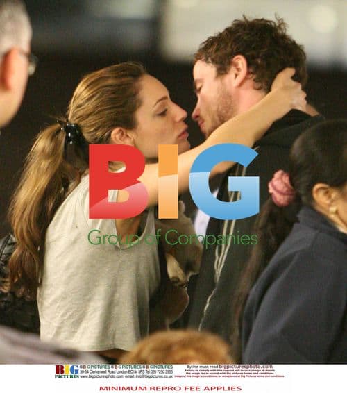 Kelly Brook Arrives at Heathrow with Boyfriend