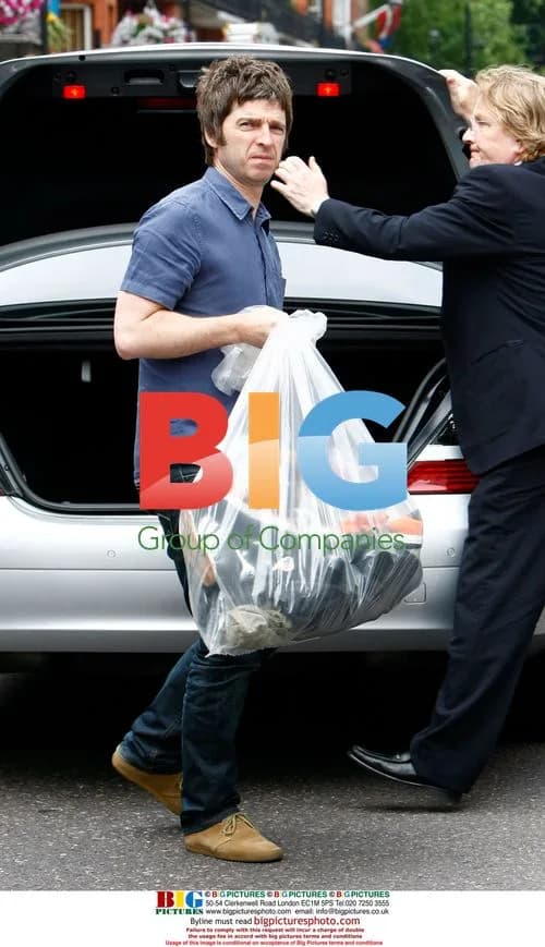 Noel Gallagher Arrives Home with Trainers