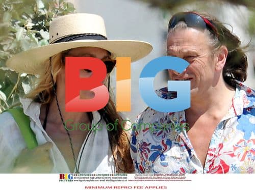 Jerry Hall and mystery boyfriend on beach