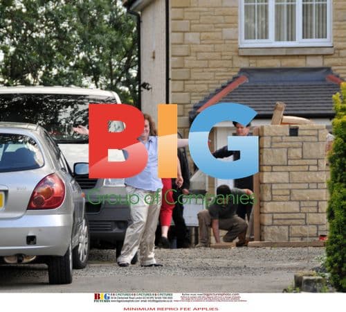 Susan Boyle Poses with Workmen at New Home