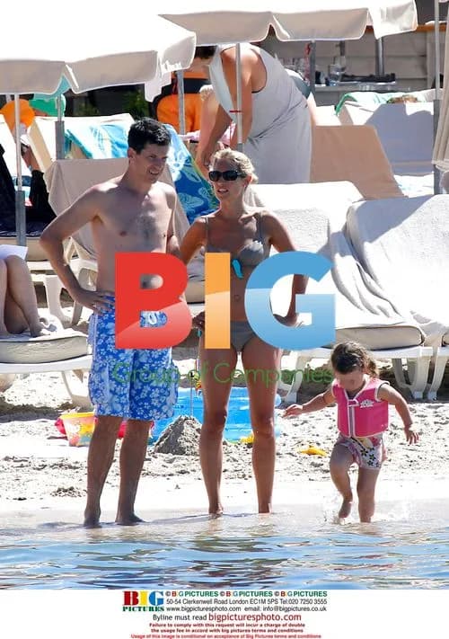 Tennis player Tim Henman at the beach with family