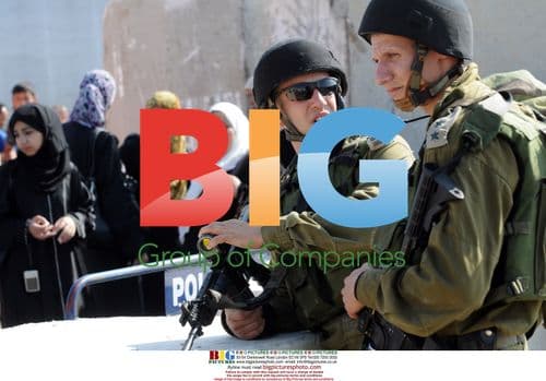 Palestinians wait at Qalandia Checkpoint during Ramadan