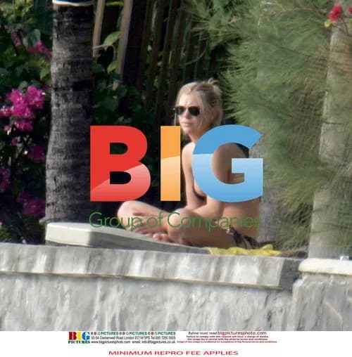 Chelsy Davy Relaxes by the Beach