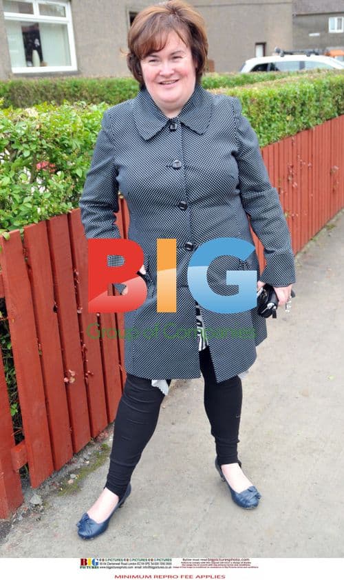 Susan Boyle laughs near home in Blackburn