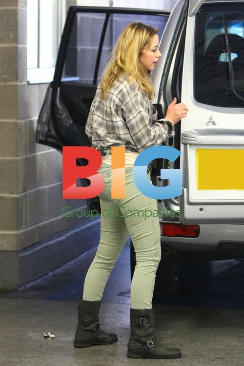 Charlotte filling up car, shopping