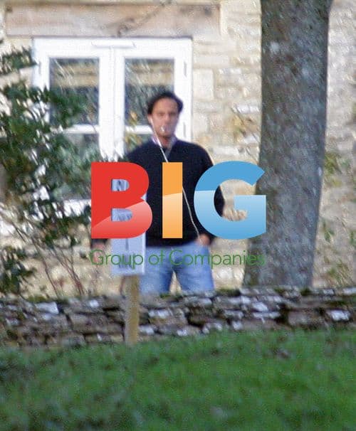 Arun Nayar pacing and smoking outside Cotswold home