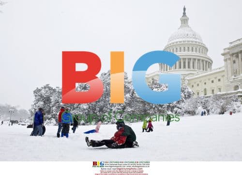 People sledding outside U.S. Capitol