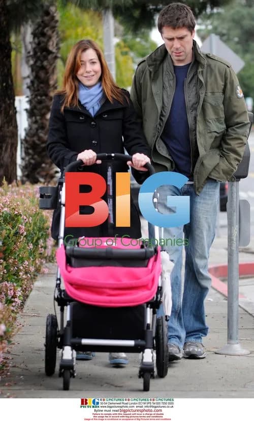 Alyson Hannigan and Family Walking in Rain