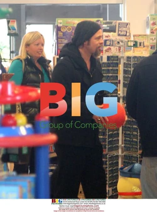 Brad Pitt goofs around at toy store in Malibu