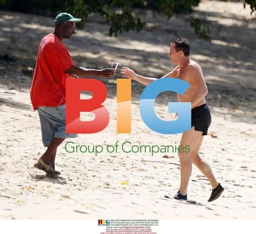 Michael Flatley swimming and on phone in Caribbean