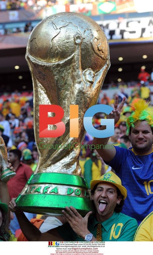 Brazil fans pose with World Cup replica