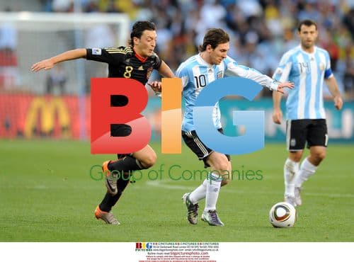 Messi and Oezil chase ball at 2010 World Cup