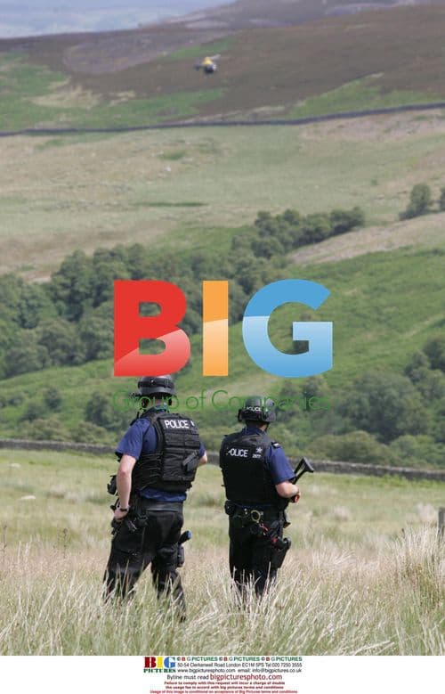 Police Search for Fugitive Gunman