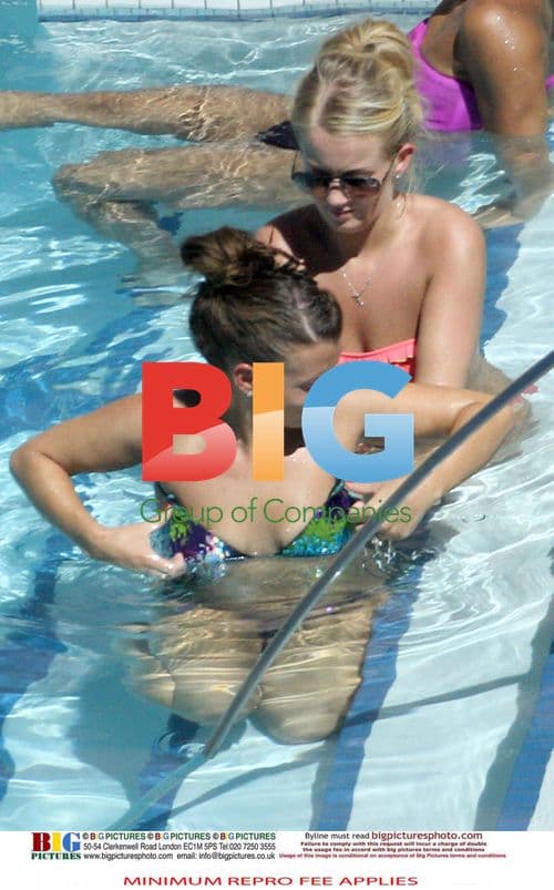 Coleen and Wayne Rooney Relaxing Poolside