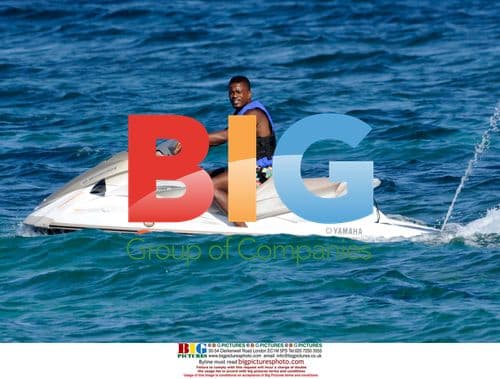 Patrice Evra and Girlfriend Relax Before Season