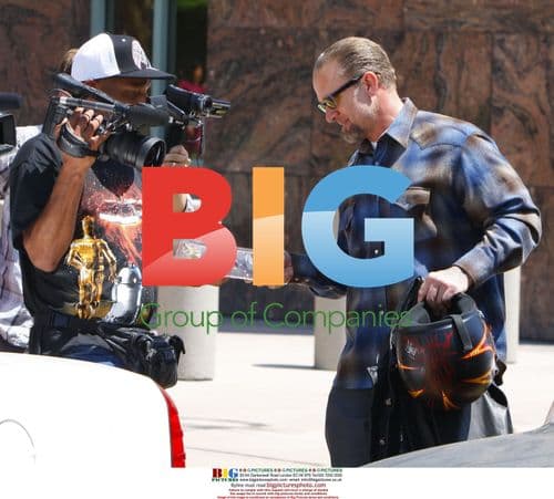 Jesse James Leaves Court with Paparazzi Gift