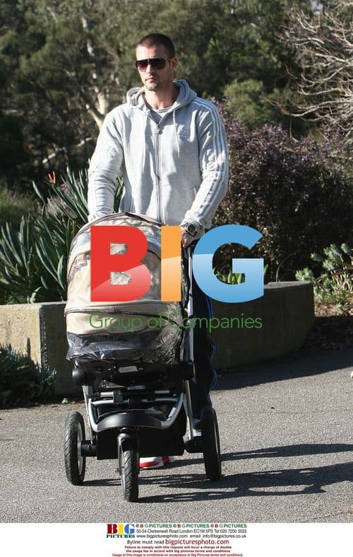 Kris Smith and family out for a walk with baby