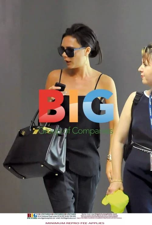 Victoria Beckham Seen with Cold Sore at Airport