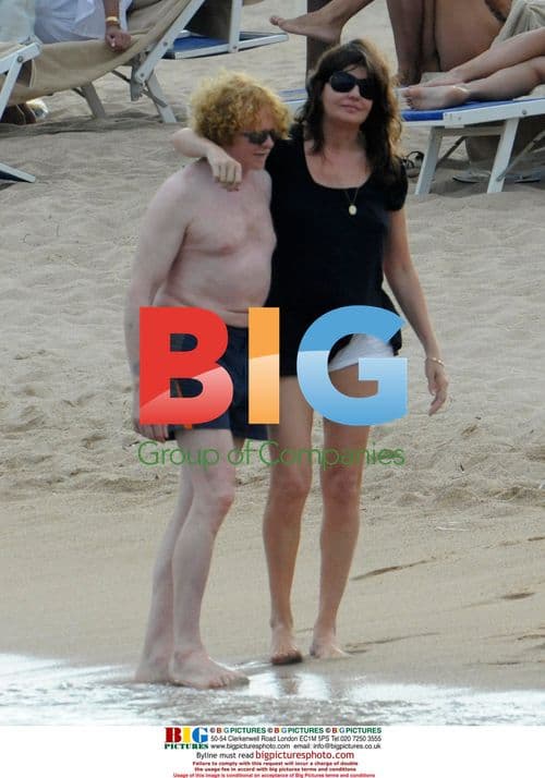 Mick Hucknall and family on beach in Sardinia