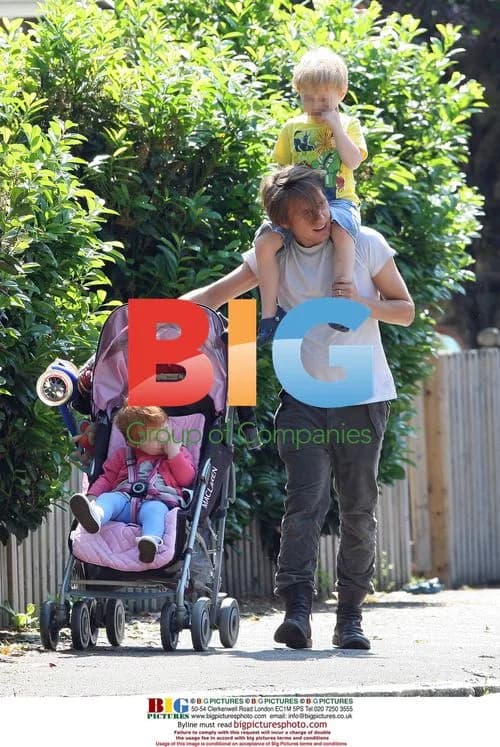 Mark Owen takes children for walk in London park