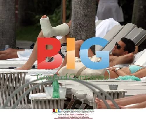 Footballer Michael Ballack Sunbathing with Wife