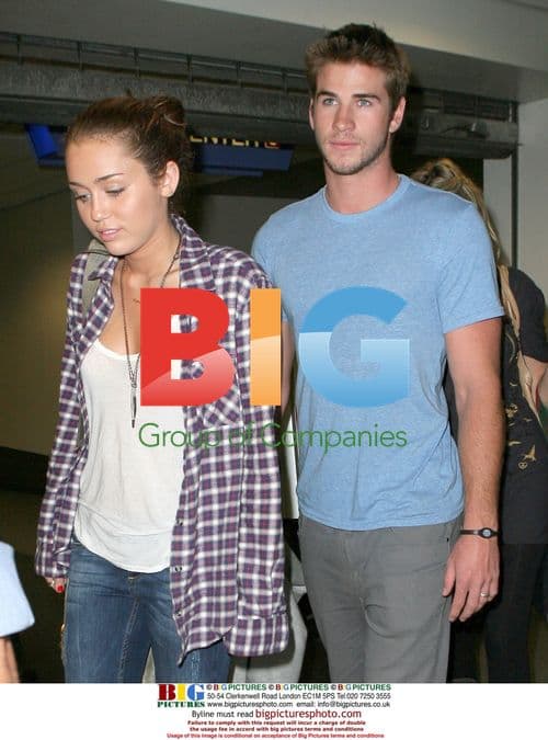 Miley Cyrus and Liam Hemsworth at LAX