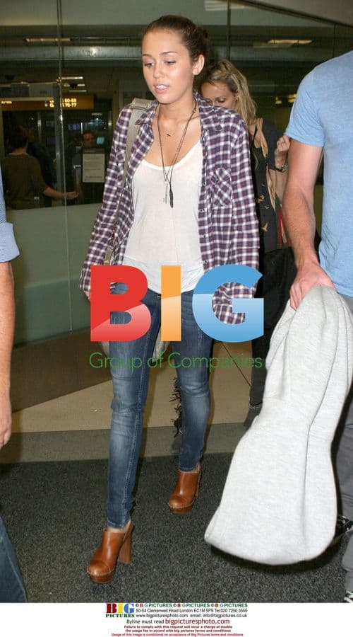 Miley Cyrus and Liam Hemsworth at LAX