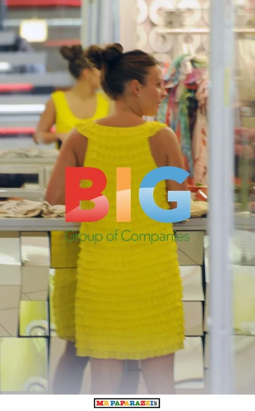 Coleen Rooney shopping in yellow dress