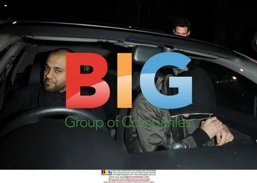 Lindsay Lohan Leaves Boujis with Two Men