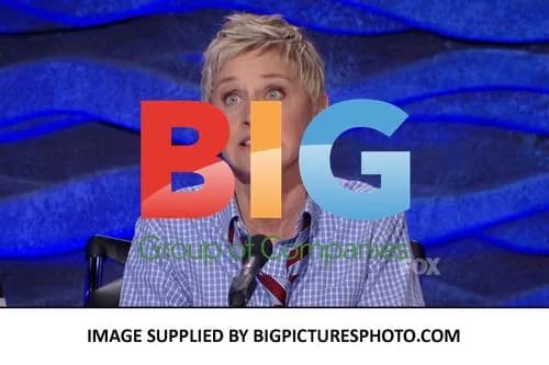 Ellen Degeneres flirting with Simon Cowell