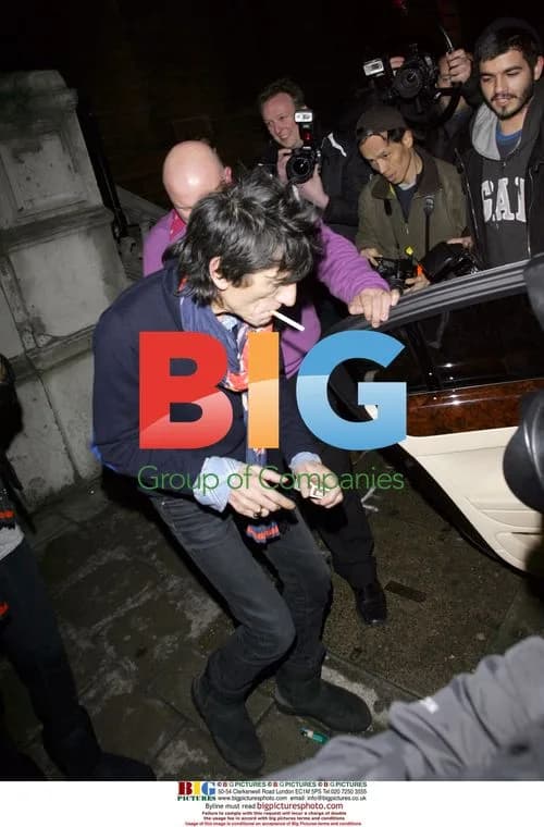 Ronnie Wood and girlfriend at art event