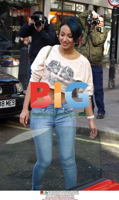 Amelle Berrabah of Sugababes in Red Sports Car