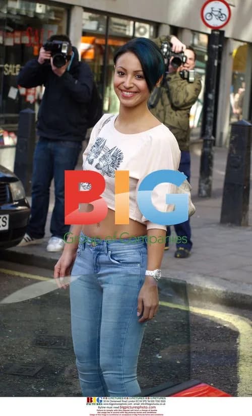 Amelle Berrabah getting into red sports car