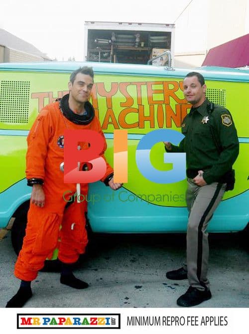 Robbie Williams in Orange Astronaut Suit