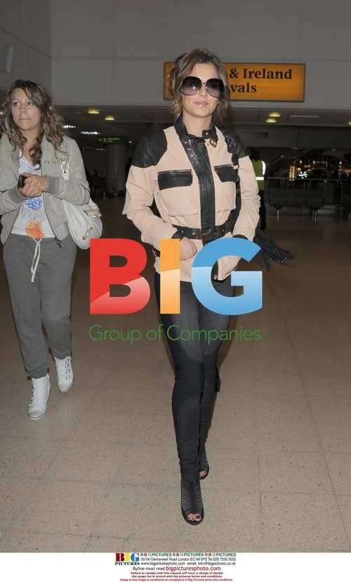 Cheryl Cole Arrives at Heathrow