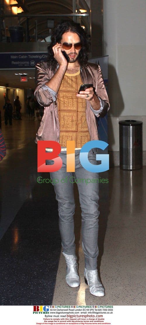 Russell Brand Arrives at LAX