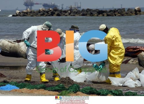 BP Workers Clean Oil from Beach in Louisiana