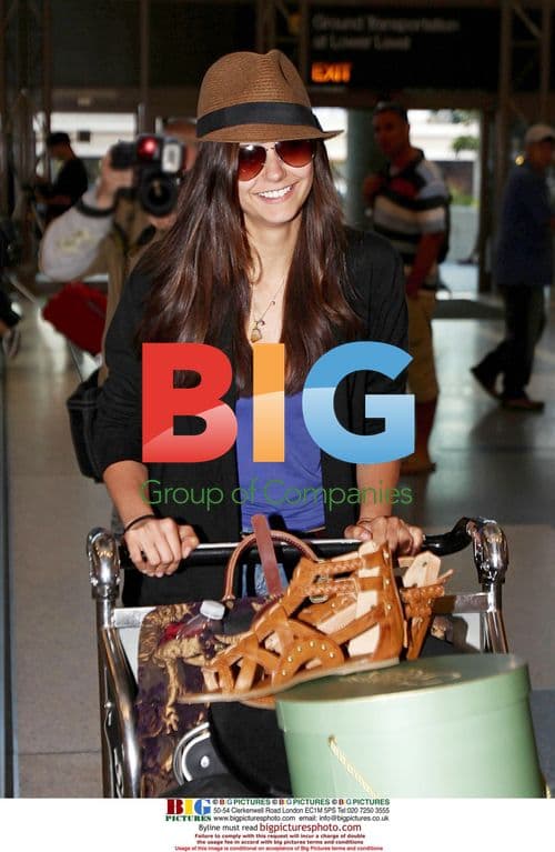 Nina Dobrev Wheels Luggage at LAX