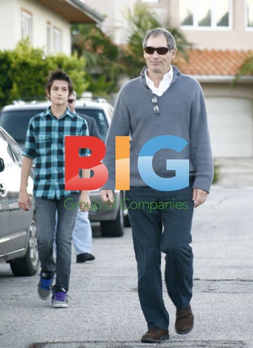 Timothy Dalton leaves Oksana Grigorieva's house