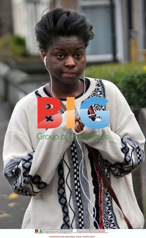 Gamu Nhengu listening to music at home