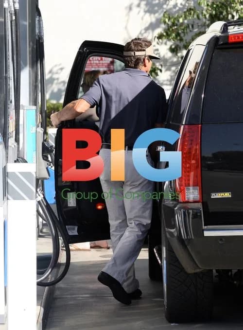 Dennis Quaid Filling SUV at Gas Station