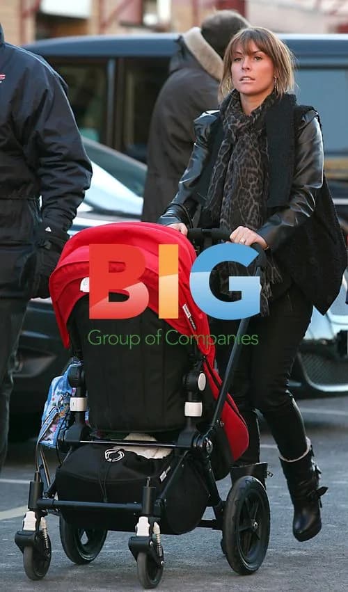 Coleen Rooney at Old Trafford with son Kai