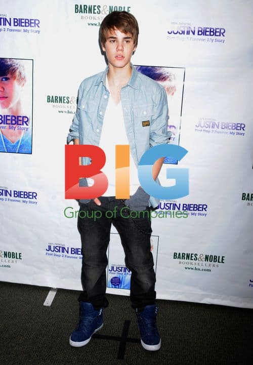 Justin Bieber Signs First Step 2 Forever Book